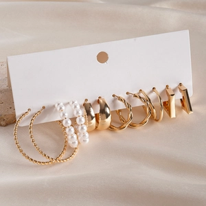 Detailed view of a 6-pair gold earring set with geometric hoops and faux pearls