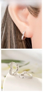 Close-up of heart-shaped hoop earrings with shimmering pave-set cubic zirconia stones