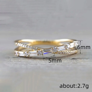 Elegant gold cross ring with micro-paved round and baguette cubic zirconia stones