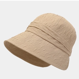 Foldable khaki sun hat for women featuring textured fabric and wide brim for sun protection