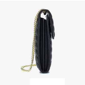 Side view of black quilted leather phone bag featuring a luxury gold chain strap