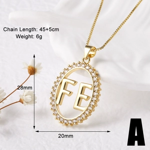 Detailed view of gold plated FE letter pendant with zircon inlay and box chain