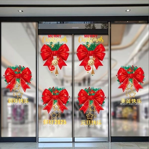 Close-up of festive red bow and pine needles on Christmas glass window stickers