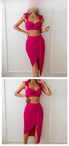 Detail of rose pink two-piece set featuring bow straps crop top and high waist slit skirt