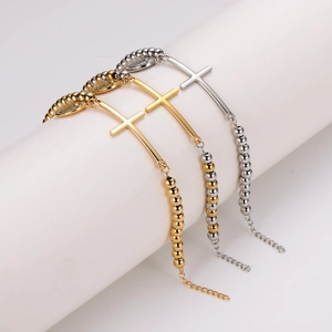 Minimalist stainless steel beaded bracelet with oval cross pendant in gold and silver