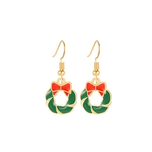 Detail of Christmas wreath earrings with red bow and alloy enamel finish on white background