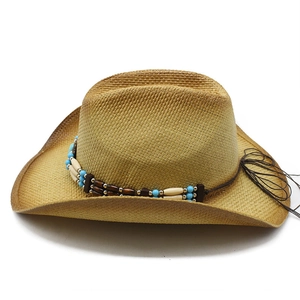Western straw cowboy hat with colorful beaded band and curved brim on white background