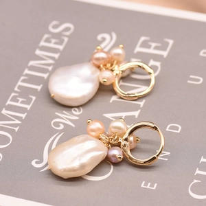 Baroque pearl drop earrings with golden hoops and pink freshwater pearl clusters