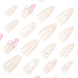 Faux ongles français roses avec perles 3D et nœuds transparents, forme amande