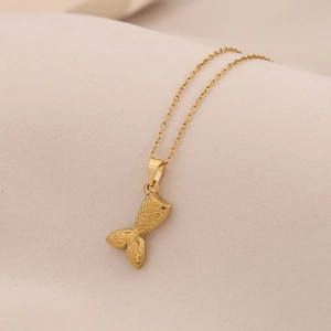 Elegant gold mermaid tail pendant necklace in stainless steel with detailed fish scales