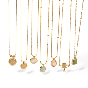 Golden titanium steel necklace set with cat eye stones and pearls in various shapes
