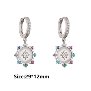 Detail of silver hoop earrings with multicolored starburst pendant, size 29x12mm