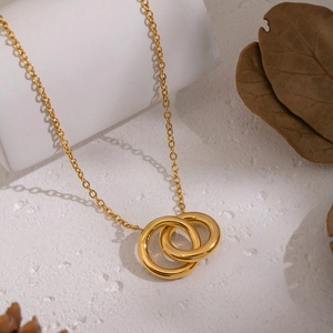 Minimalist double interlocking circle pendant necklace in gold-plated stainless steel