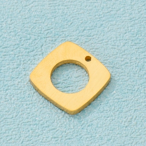 Macro shot of geometric gold-plated hollow square pendant with a brushed metal finish