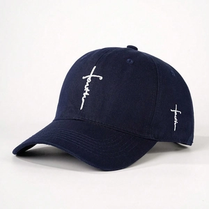 Detailed embroidery of white Faith text and cross on navy blue cotton baseball cap