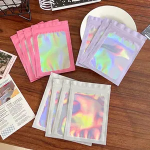 Holographic colorful resealable storage bags for jewelry and cards displayed on a table