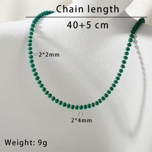 Detail view of emerald beaded necklace with dimensions showing 40 plus 5cm chain length