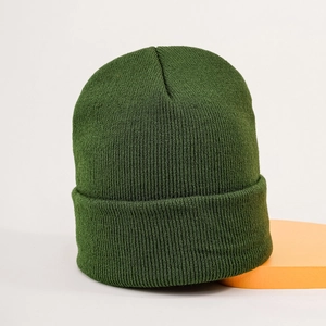 Detailed close-up showing the dark green ribbed knit texture of this warm winter beanie