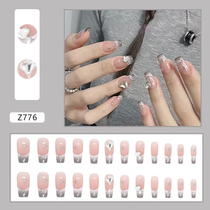 Pink and grey gradient coffin press-on nails with rhinestone stars and heart accents
