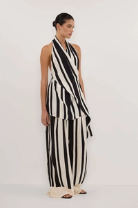 Detail of elegant black and white striped halter wrap top and wide leg trousers set