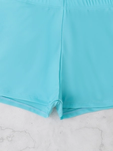 Detail of light blue high-stretch swim shorts with premium flatlock stitching and soft fabric