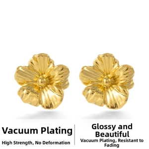 Macro detail of vintage 3D gold-plated flower stud earrings with radial petal textures