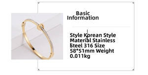 Detail view of gold heart bangle with inlaid rhinestones and 316L stainless steel specs