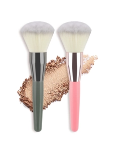 Macro view of soft gradient fiber bristles on two large powder and blush makeup brushes