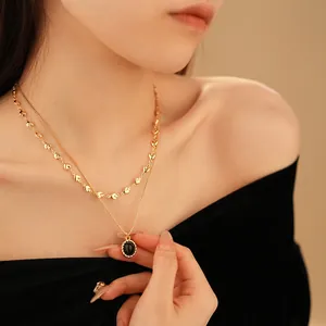 Vintage double layer gold heart chain necklace with an oval black gemstone pendant