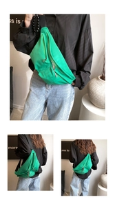 Detail of green nylon crossbody bag with multi-zipper pockets and wide strap