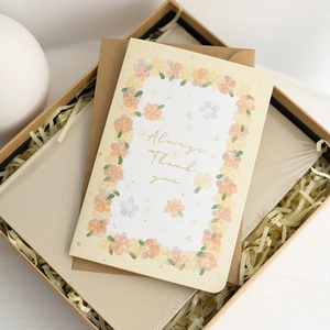 Elegant gift set with floral 3D card, brown envelope, and notebook in a premium kraft box