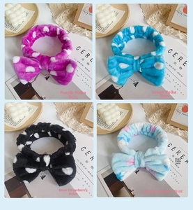 Macro display of four plush bow headbands featuring leopard, polka dot and strawberry prints