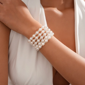 Detail of five-layer faux pearl bracelet with sparkling rhinestone spacers for women
