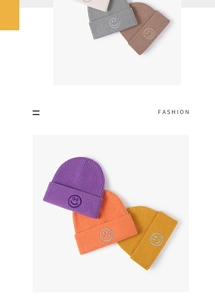 Close-up of winter knit beanies in various colors with minimalist smiley face embroidery