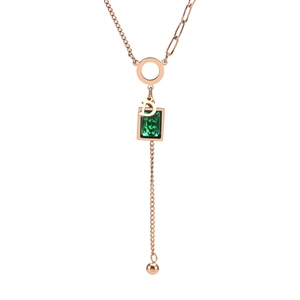 Detailed view of emerald pendant necklace with white zircon and a gold letter D charm