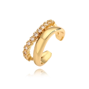 Detail of a minimalist gold double-layered ear cuff with micro-pave zircons and smooth finish