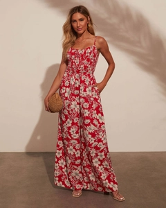 Detail of red floral wide-leg jumpsuit with smocked bodice and tropical flower print