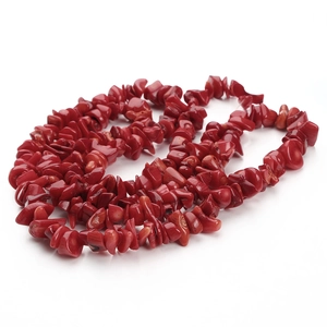 Close-up of natural irregular red coral stone beads for DIY jewelry making accessories