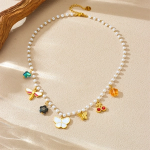 Fashion pearl chain necklace with colorful butterfly, cherry, and star charms in gold finish