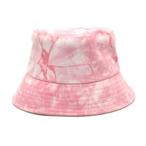 Detail view of the pink and white tie-dye fabric texture and stitching on the bucket hat