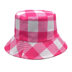 Detailed view of pink and white plaid pattern on a casual cotton bucket hat fabric