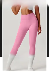 Detail view of pink high-waisted yoga pants with functional side pocket and tummy control