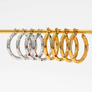 Polished stainless steel hoop earrings with colorful rhinestones in gold and silver