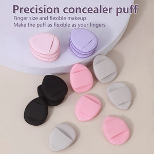Set of mini finger concealer sponges in colorful teardrop shapes with finger straps