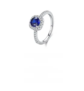 Macro shot of S925 silver ring featuring a blue square gemstone with pavé diamonds