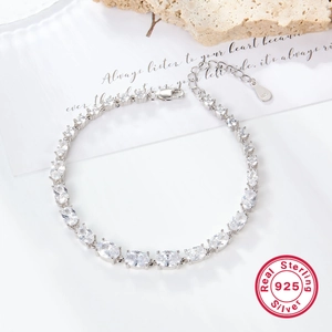 S925 sterling silver tennis bracelet featuring oval cubic zirconia in claw setting
