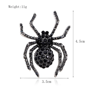 Vintage spider brooch with black rhinestones in silver finish, size 4.5cm by 3.5cm