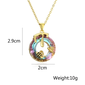 Detailed view of bee and honey drop crystal necklace pendant with 2.9cm height measurement