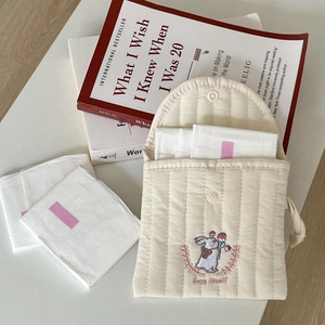 Quilted cream sanitary napkin pouch with cute rabbit embroidery and white snap button