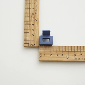 Matte blue square mini hair claw clip for women shown with ruler measurement for size